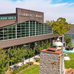The Barlow in Sebastopol with outdoor shops, tasting rooms, and people walking through the open‑air marketplace.